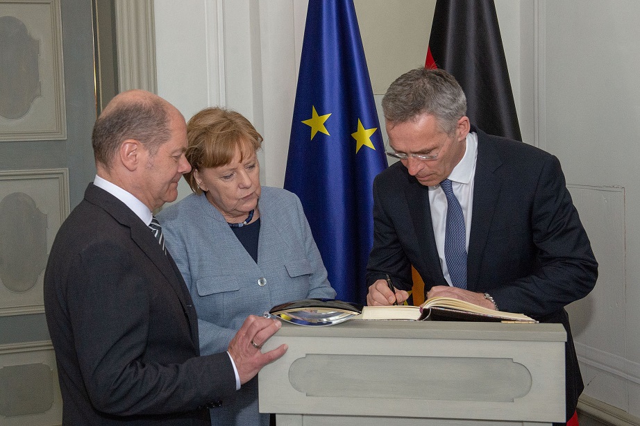 olaf_scholz_angela_merkel_jens_stoltenberg_federal_minister_of_germany_for_finance_nato_secretary_general_german_chancellor_kritisches_netzwerk_aufruestung_bundeswehr.jpg